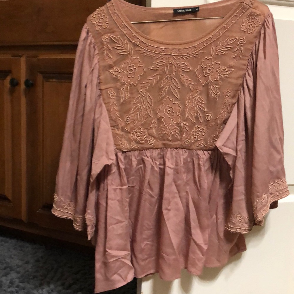 Blouse color is salmon